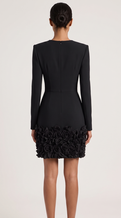 Black V-neck mini dress with 3D rose embellishment, back view