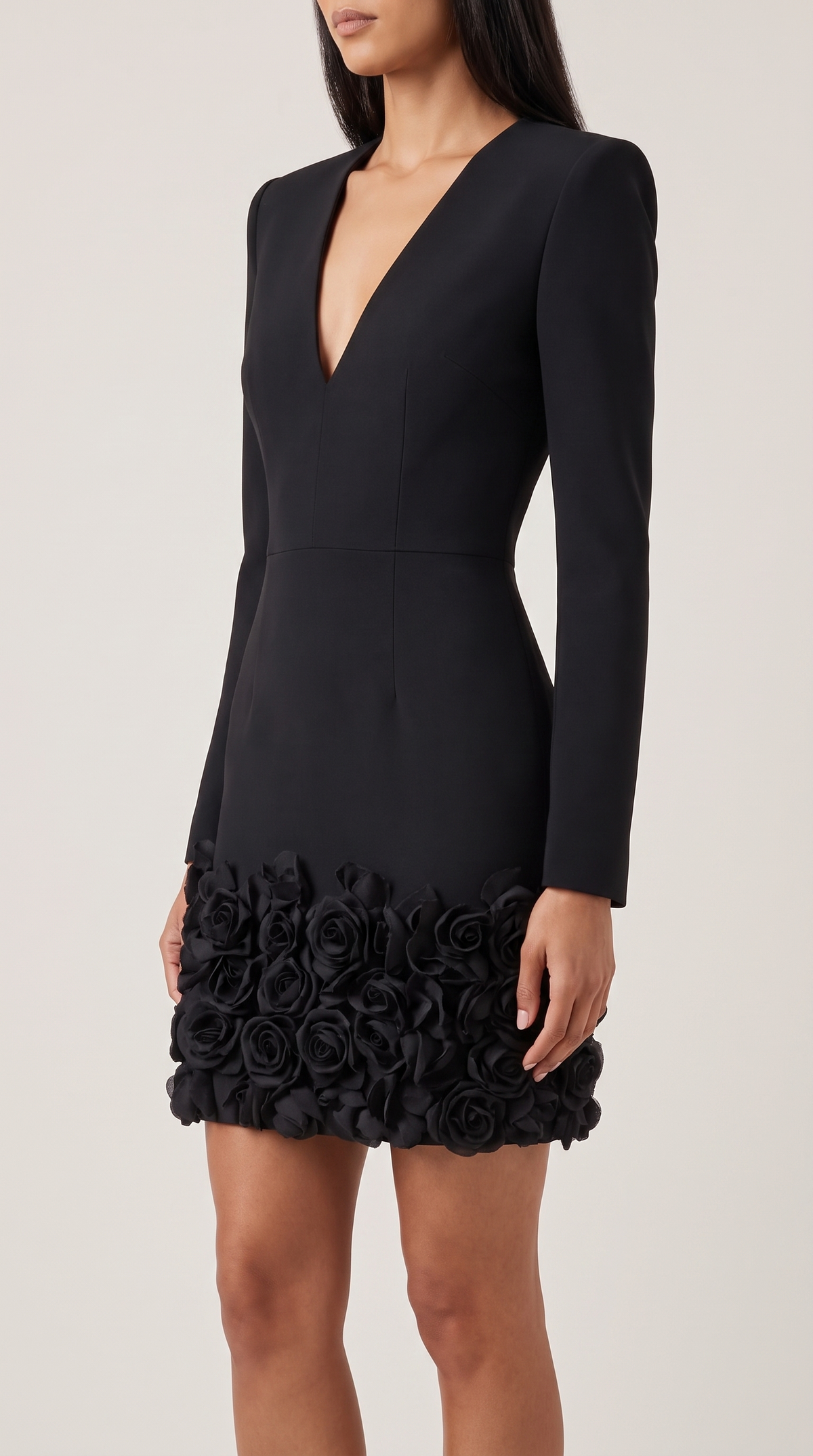 Black V-neck mini dress with 3D rose embellishment, side view