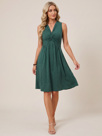 Sleeveless twist knot front casual dress, walking pose