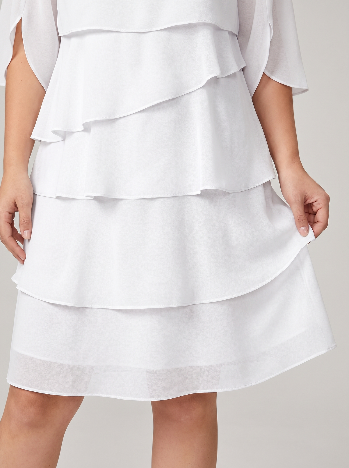 Ruffled layered flutter sleeve dress, skirt detail