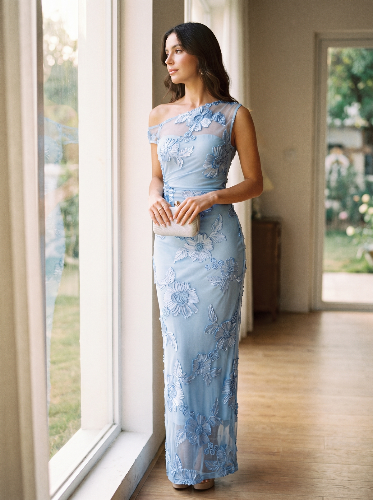 Full length silhouette of the embroidered one shoulder maxi gown